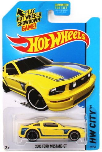 1:64 2005 Ford Mustang GT (Yellow w/Blue Stripes) 1:64 2005 Ford Mustang GT (Yellow w/Blue Stripes)